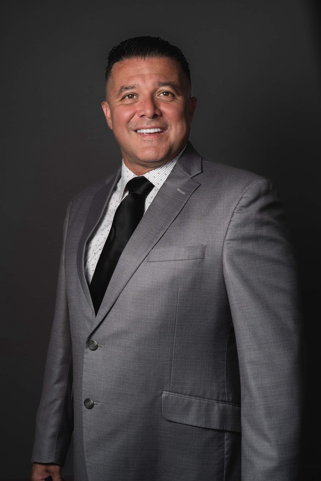 Rafael Villicana in a gray suit